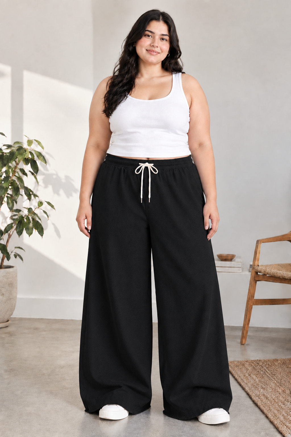 Woman modeling Eastrobe stretch wide-leg jeans in the XL–2XL fit